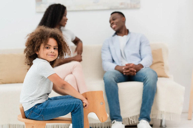 Parents and children together in a warm family therapy session