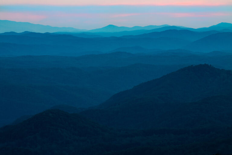 Calm layered mountain ridges at dusk