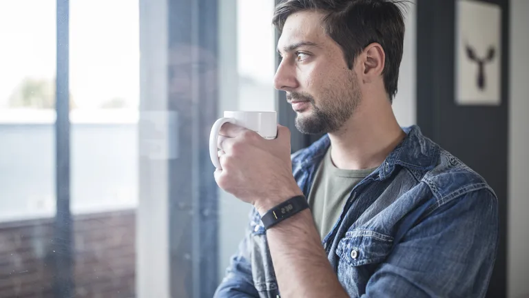Man reflecting over morning coffee — substance use counseling in Virginia
