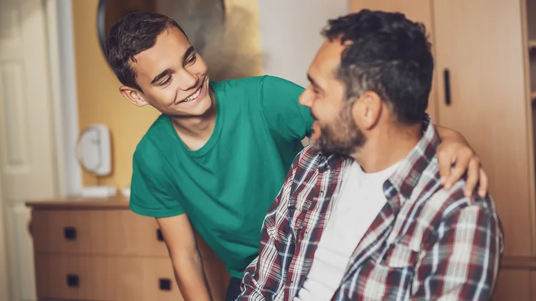 Father and teenage son talking honestly — child and teen therapy in Virginia